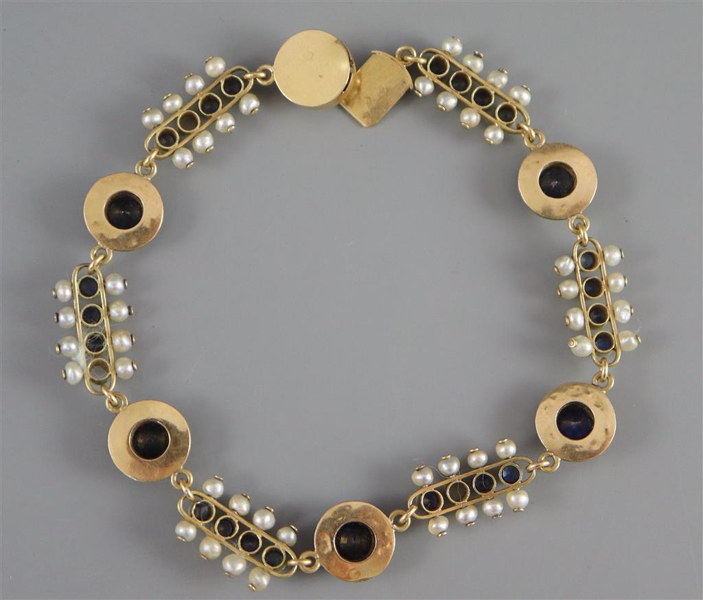 A late 19th/early 20th century French 18ct gold, sapphire and seed pearl set bar and circular link bracelet,